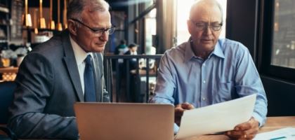 Two men looking at documents